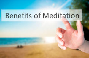 Benefits of Meditation - Hand pressing a button on blurred background concept . Business technology internet concept. Stock Photo